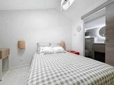 Un ou plusieurs lits dans un hébergement de l'établissement Les Vignes 3 Chambres avec Salle de bain privative