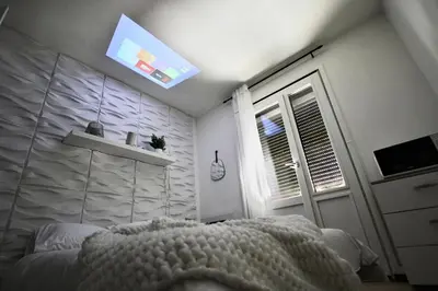 Un ou plusieurs lits dans un hébergement de l'établissement Petit Studio - Metro B - Hôpital Lyon Sud