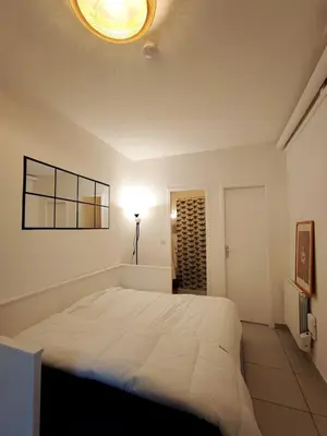 Un ou plusieurs lits dans un hébergement de l'établissement Cosy studio 14m2 centre-ville