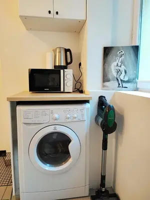 Cuisine ou kitchenette dans l'établissement Cosy studio 14m2 centre-ville