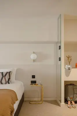 Un ou plusieurs lits dans un hébergement de l'établissement MiHotel - Rue Cuvier
