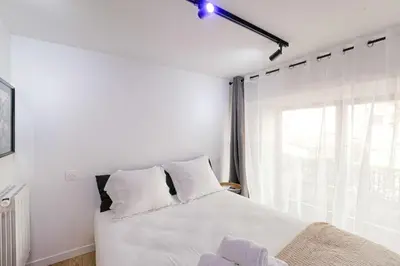 Un ou plusieurs lits dans un hébergement de l'établissement Cosy et Chaleureux duplex Brotteaux - Masséna