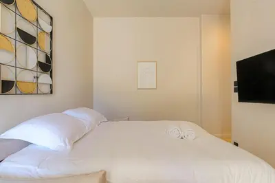 Un ou plusieurs lits dans un hébergement de l'établissement Studio avec terrasse aux portes de Lyon, Ecully