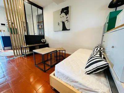Un ou plusieurs lits dans un hébergement de l'établissement Chez Auguste - charmant studio 3 étoiles