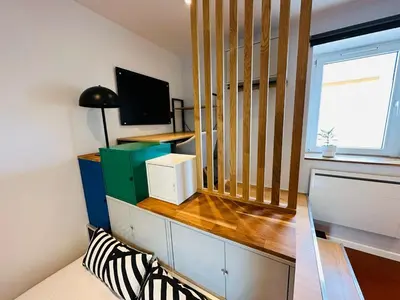 Télévision ou salle de divertissement dans l'établissement Chez Auguste - charmant studio 3 étoiles