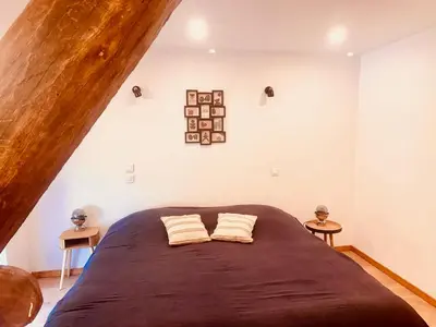 Un ou plusieurs lits dans un hébergement de l'établissement Superbe maison en pierre
