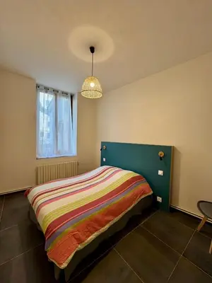 Un ou plusieurs lits dans un hébergement de l'établissement Appartement à Vienne