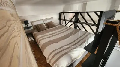 Un ou plusieurs lits dans un hébergement de l'établissement Duplex cosy-Wifi-Parking-Netflix-Lyon 9