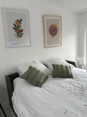 Un ou plusieurs lits dans un hébergement de l'établissement Studio le cocon aux portes de Lyon