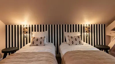 Un ou plusieurs lits dans un hébergement de l'établissement Host Inn Wow House