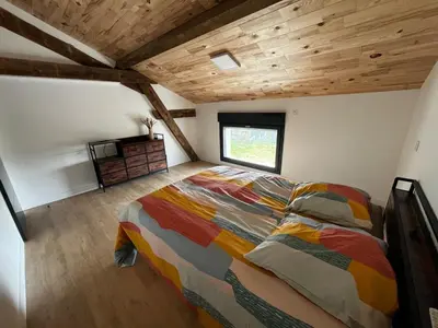 Un ou plusieurs lits dans un hébergement de l'établissement Villa en campagne