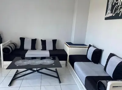Coin salon dans l'établissement Joli appartement limite Lyon 8, tram T4