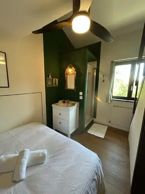 Un ou plusieurs lits dans un hébergement de l'établissement La Rose du Petit Bois