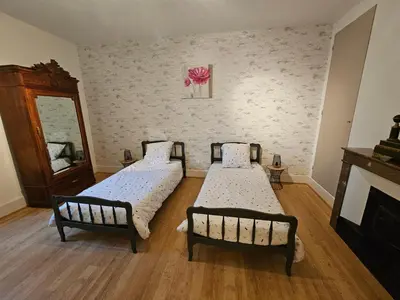 Un ou plusieurs lits dans un hébergement de l'établissement Le gîte de la Rose