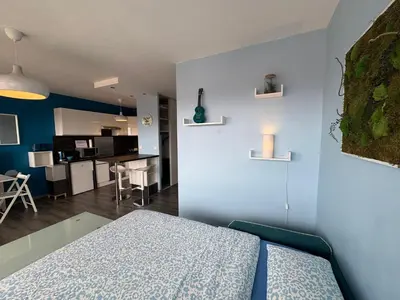 Un ou plusieurs lits dans un hébergement de l'établissement L'azur cosy studio Meyzieu