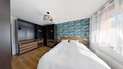 Un ou plusieurs lits dans un hébergement de l'établissement 4 chambres - 200m2 - Parking - Jardin