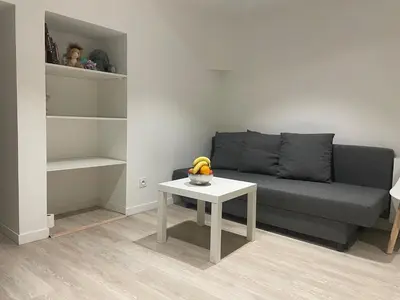 Coin salon dans l'établissement Un charmant appartement bien équipé