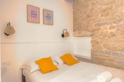 Un ou plusieurs lits dans un hébergement de l'établissement Caractère et Charmant à Hôtel de Ville