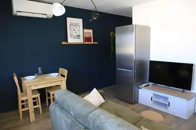 Télévision ou salle de divertissement dans l'établissement Superbe appartement T2