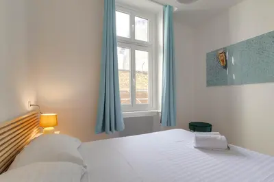 Un ou plusieurs lits dans un hébergement de l'établissement Superbe appartement sur la Presqu'île - Lyon