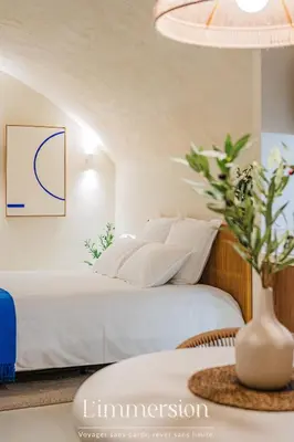 Un ou plusieurs lits dans un hébergement de l'établissement Hélios, Suite Grecque & Spa