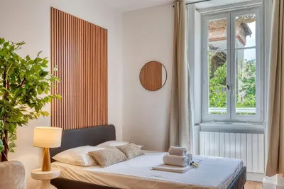 Un ou plusieurs lits dans un hébergement de l'établissement Le Dock Lodge - Studio - proche quai de Saone