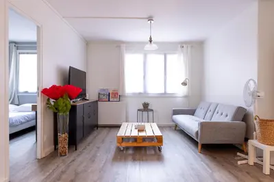 Coin salon dans l'établissement Le Jules, 3 chambres, parking à Vénissieux