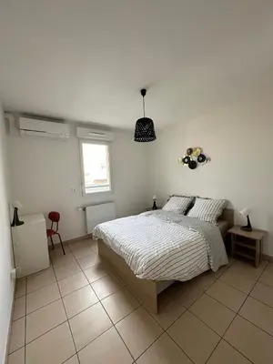 Un ou plusieurs lits dans un hébergement de l'établissement Appartement T3
