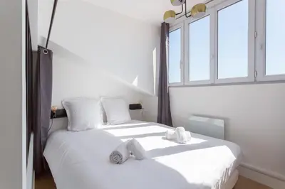 Un ou plusieurs lits dans un hébergement de l'établissement Belfort- Duplex