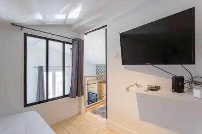 Télévision ou salle de divertissement dans l'établissement Belfort- Duplex