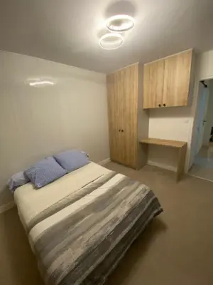 Un ou plusieurs lits dans un hébergement de l'établissement Appartement 2 chambres 5 pièces paisible