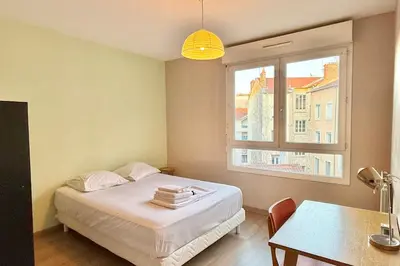 Un ou plusieurs lits dans un hébergement de l'établissement Balcon Jubin