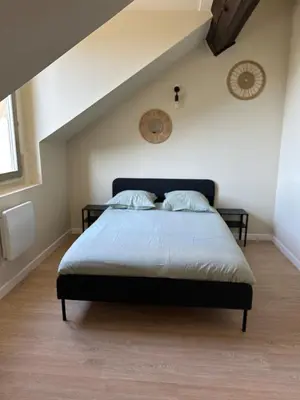 Un ou plusieurs lits dans un hébergement de l'établissement Appartement gare chateaucreux