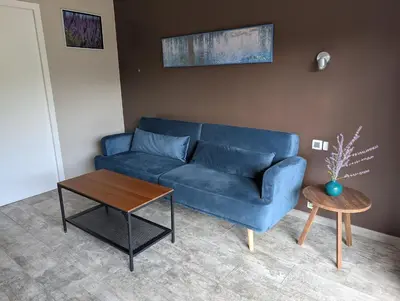 Coin salon dans l'établissement Appartement F2 rez-de-jardin