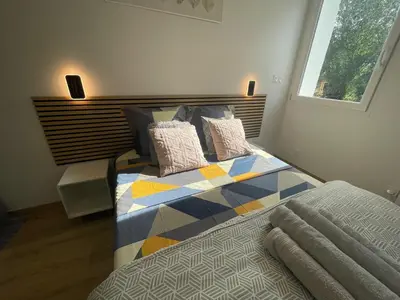 Un ou plusieurs lits dans un hébergement de l'établissement T2 Sweet Horizon 2 - B at Home - Stade Groupama LDLC