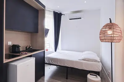 Un ou plusieurs lits dans un hébergement de l'établissement LES BULLES DE MONA - Alcove - Spa - Clim