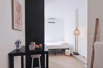 Un ou plusieurs lits dans un hébergement de l'établissement LES BULLES DE MONA - Alcove - Spa - Clim