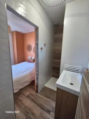 Un ou plusieurs lits dans un hébergement de l'établissement Appartement T2 avec jardin - Saint Maurice l'Exil
