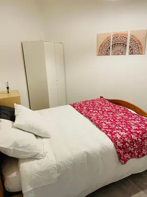 Un ou plusieurs lits dans un hébergement de l'établissement Appartement fonctionnel