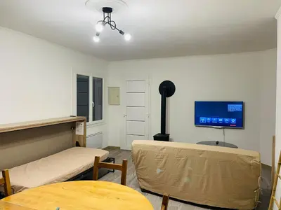 Télévision ou salle de divertissement dans l'établissement Appartement fonctionnel