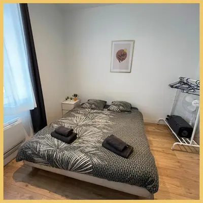 Un ou plusieurs lits dans un hébergement de l'établissement Appartement St Genis Laval Hyper centre