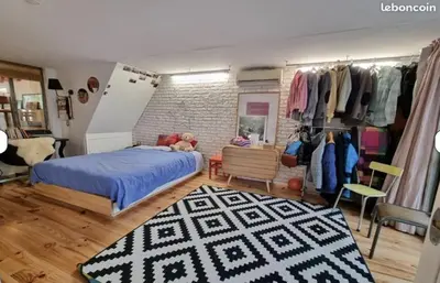 Un ou plusieurs lits dans un hébergement de l'établissement Large loft with terrace