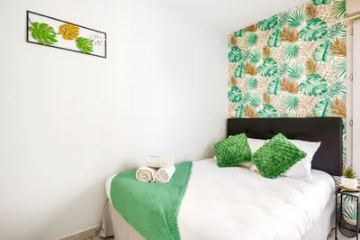 Un ou plusieurs lits dans un hébergement de l'établissement BnGo I Le Nid Cosy PartDieu I 2pers