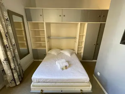 Un ou plusieurs lits dans un hébergement de l'établissement Studio cosy, proche de la Tête d'Or, Lyon