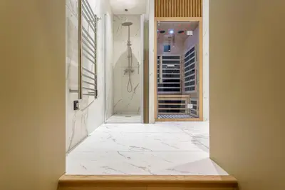 Un ou plusieurs lits dans un hébergement de l'établissement L'Exclusif Spa Suites Prestige Lyon Croix-Rousse