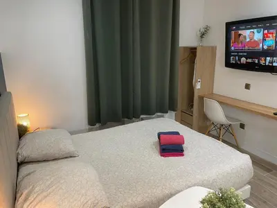 Un ou plusieurs lits dans un hébergement de l'établissement CHARMANT STUDIO à MONTCHAT