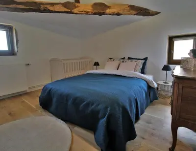 Un ou plusieurs lits dans un hébergement de l'établissement Maison Forte DES GRANDS MAISONS
