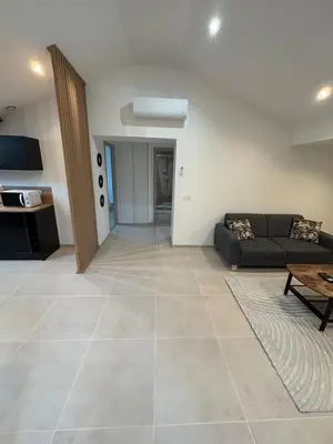 Coin salon dans l'établissement Appartement moderne rénové et tout équipé