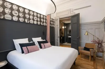Un ou plusieurs lits dans un hébergement de l'établissement MiHotel Gailleton