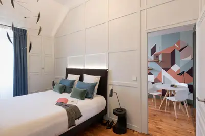 Un ou plusieurs lits dans un hébergement de l'établissement MiHotel Gailleton